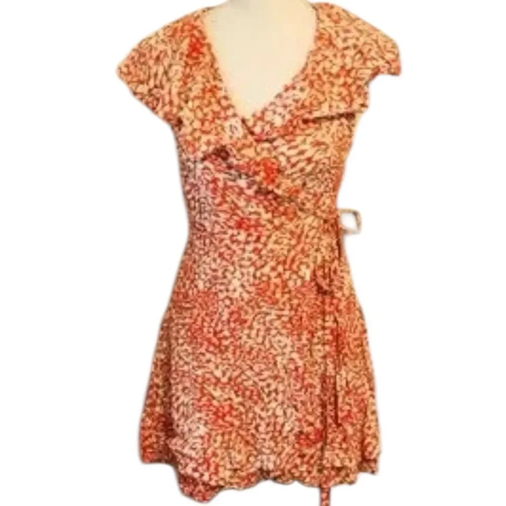 Free People French Quarter Wrap Mini Dress orange and white animal small